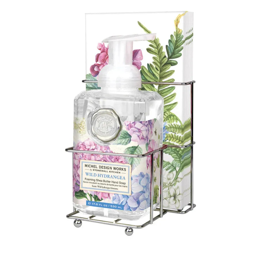 Michel Design Works Wild Hydrangea foaming hand soap and napkin set in a silver metal caddy.