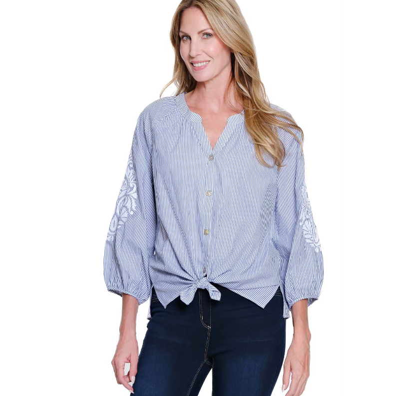 Shop the Multiples 3/4 raglan sleeve shirt in chambray blue. Features a band collar, button-front, and adjustable tie-waist for a flattering, custom fit.