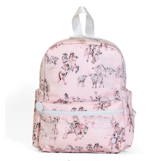 Small pink and white Cowgirl Toile print mini backpack with white zippers and adjustable padded straps.