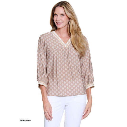 Woman wearing a Multiples taupe and white patterned V-neck top with embroidery and 3/4 cuffed sleeves.