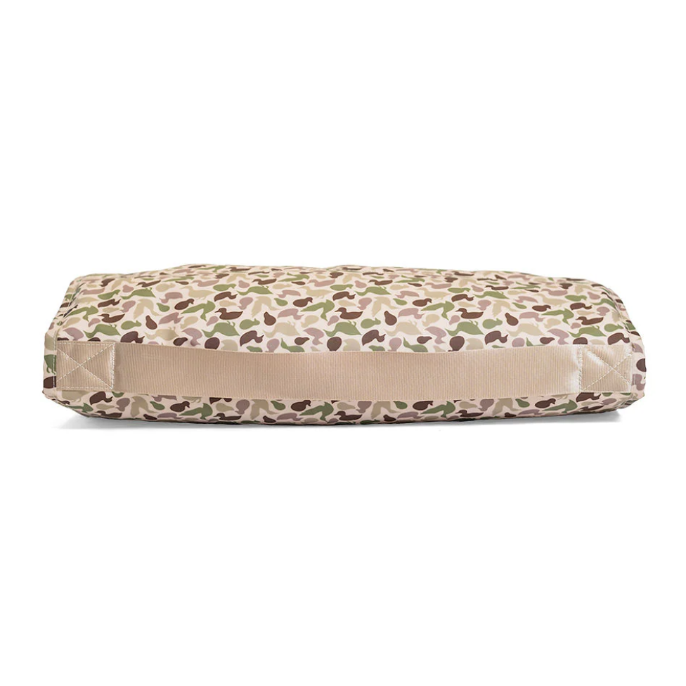 TRVL Design Rest Up! Nap Mat in green Decoy Camo; wipeable water-resistant exterior with white plush fleece lining.