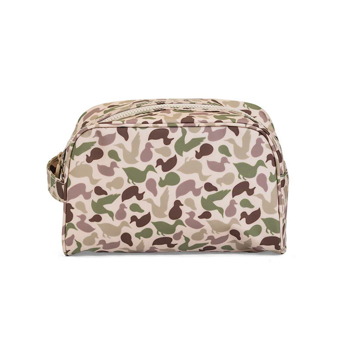 TRVL Design Stowaway Toiletry Bag in green Decoy camo; large wipeable and water-resistant cosmetic bag with side handle.