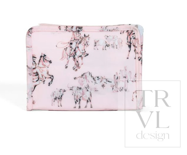 TRVL Design Roadie Small Zip Pouch in Cowgirl Toile western print showcasing its compact zippered shape and cream/blue illustrated pattern.