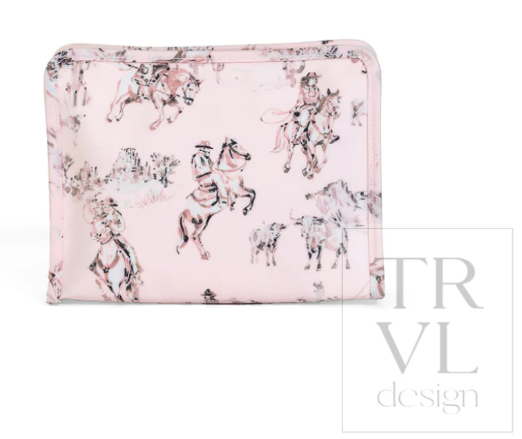TRVL Design Roadie Medium Zip Pouch in Cowgirl Toile print highlighting its flat, single-compartment zippered makeup bag silhouette.