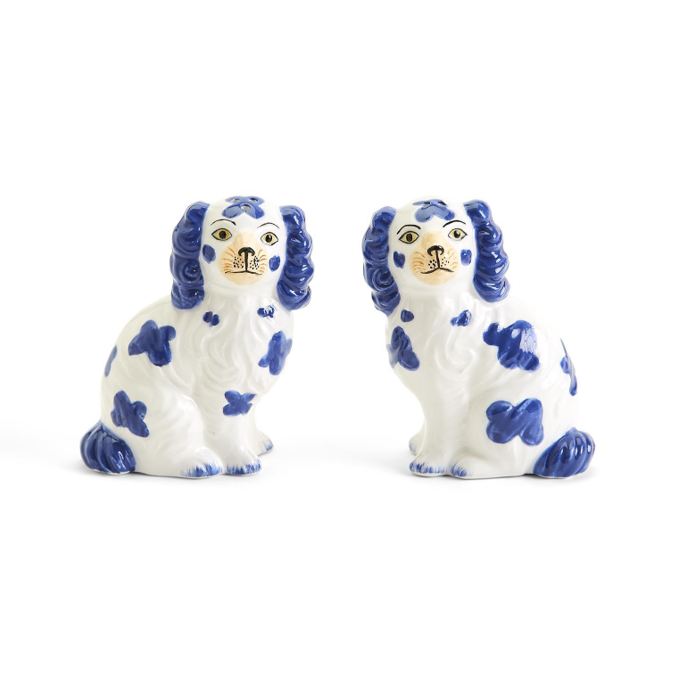 Close-up of the high-glaze finish and hand-painted blue floral details on the Staffordshire dog shakers.
