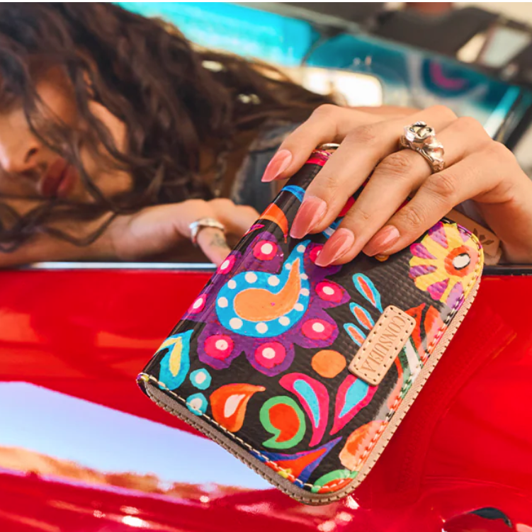 Consuela Sophie Zippy Wallet featuring a floral ConsuelaCloth exterior and natural leather trim.