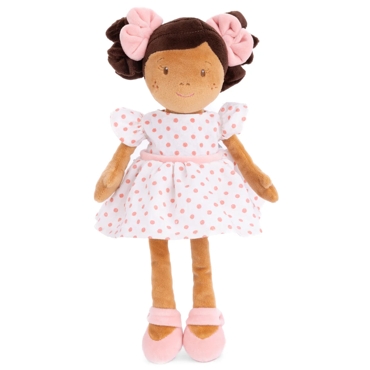 12-inch plush doll named Simone with brown pigtails wearing a white and pink polka-dot dress.