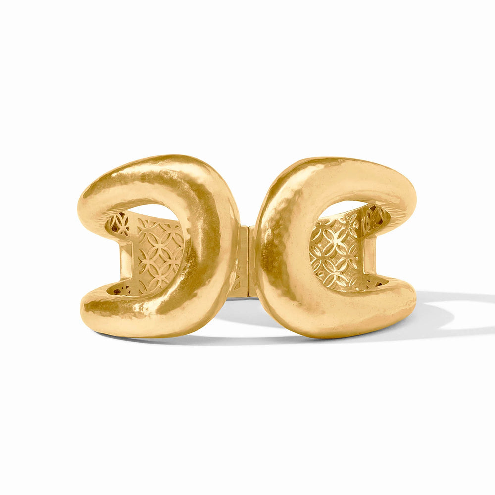 Close-up of the spring hinge mechanism and the Julie Vos hallmark on the interior of the gold Solara Cuff.