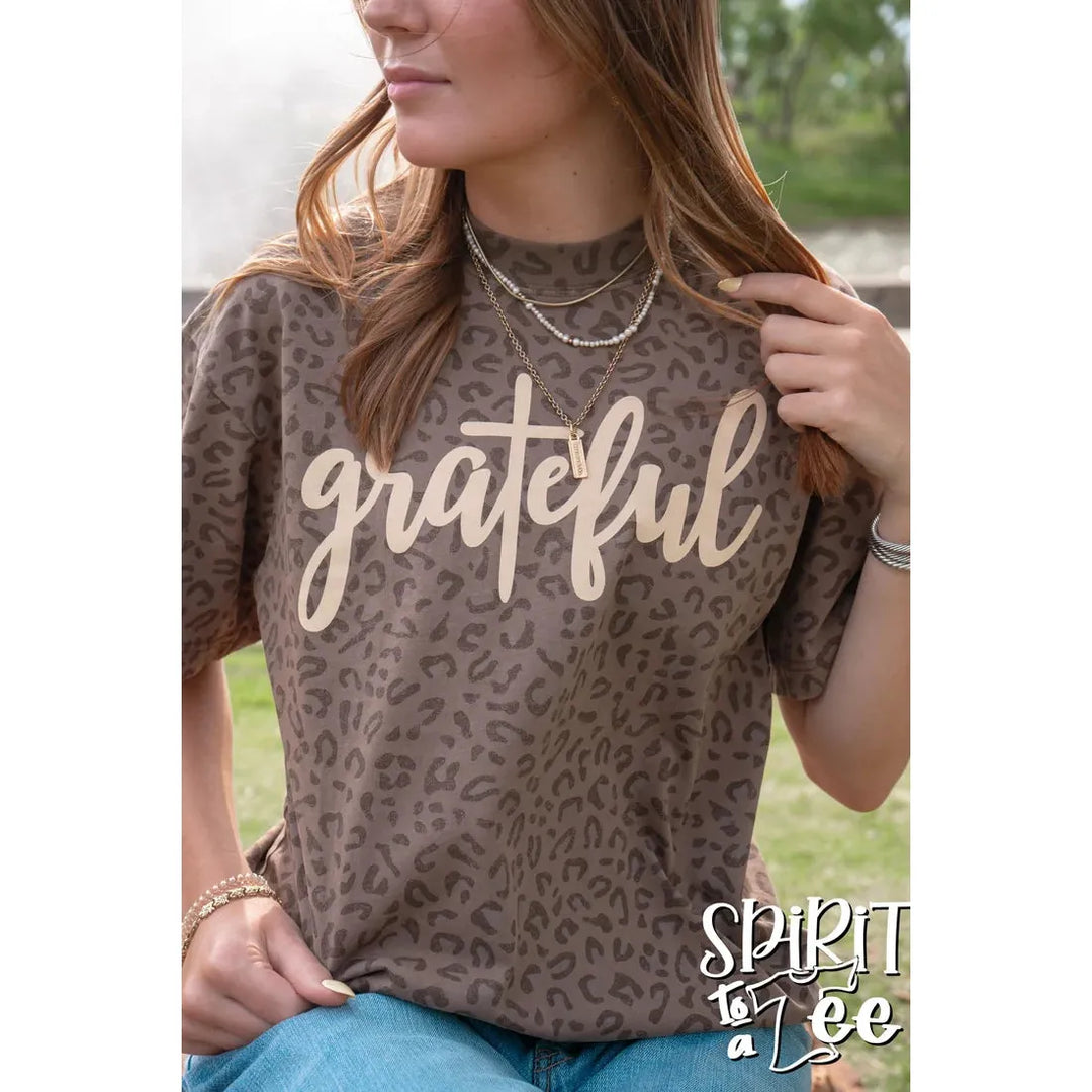 Close-up of the Spirit to a Tee Grateful brown animal print drop-shoulder graphic tee.