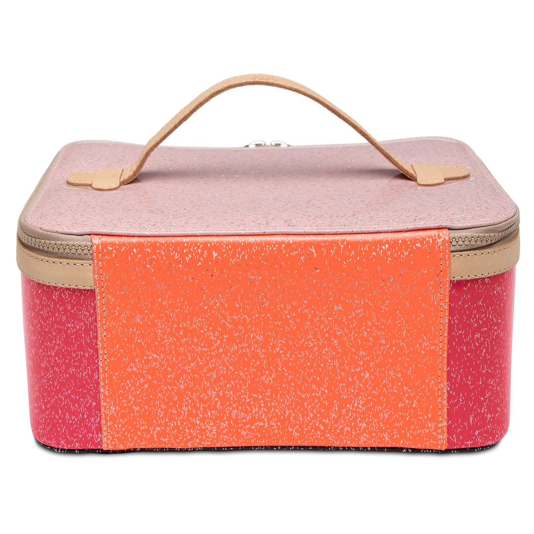 Consuela Bae Train Case featuring a bright multi-colored glitter exterior and natural leather trim.