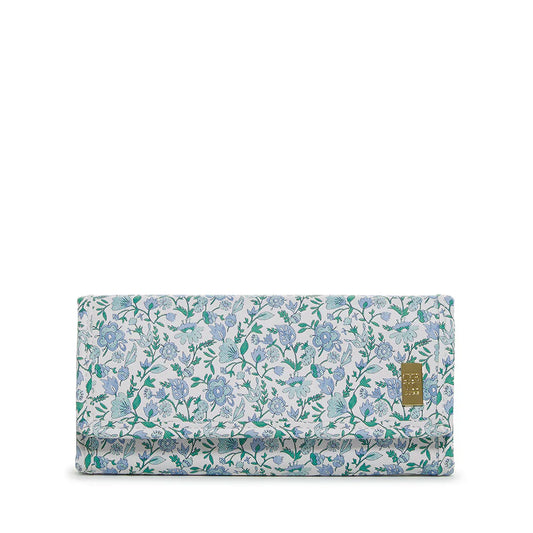 Rectangular blue and white floral jewelry travel wallet with snap closure and pinstripe interior.