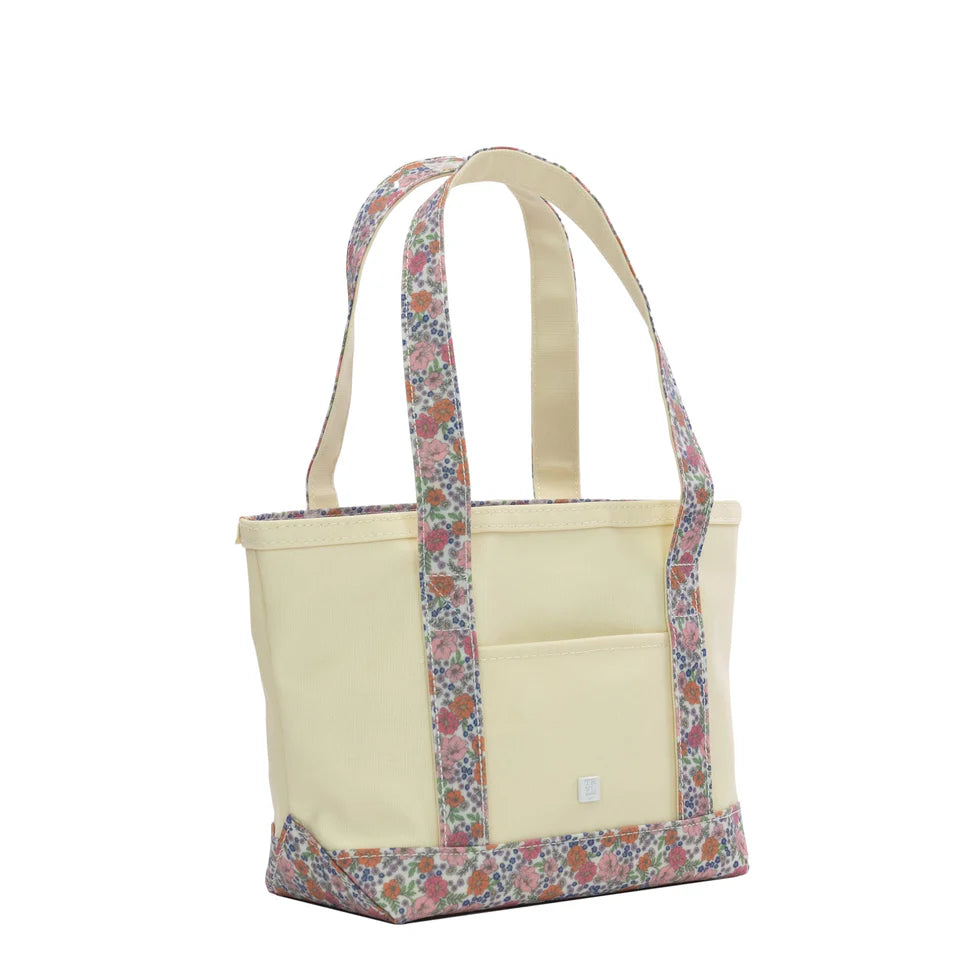 Small natural canvas tote bag with Garden Floral handles and trim, featuring a white zipper.