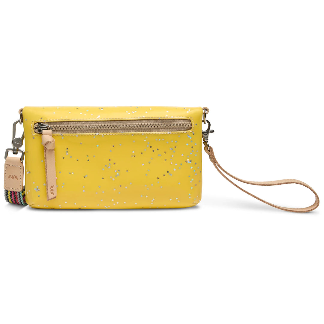 Close up of the three zipper compartments and woven adjustable strap on the Harlow Crossbody.