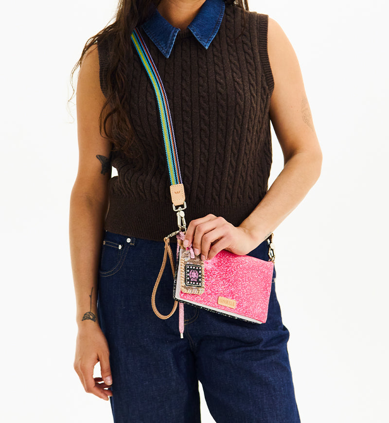 Consuela Bae Uptown Crossbody bag featuring a multi-colored glitter exterior and leather trim.