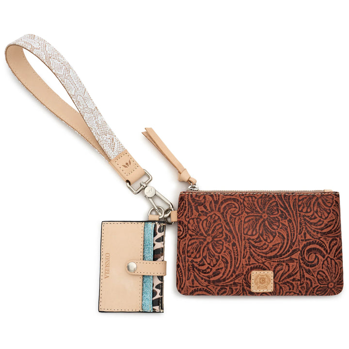 Consuela Sally Combi featuring a brown tooled leather exterior pouch, Diego leather cardholder, and snake print wristlet strap.