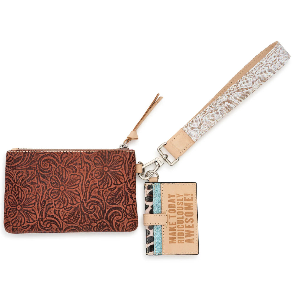 Consuela Sally Combi featuring a brown tooled leather exterior pouch, Diego leather cardholder, and snake print wristlet strap.