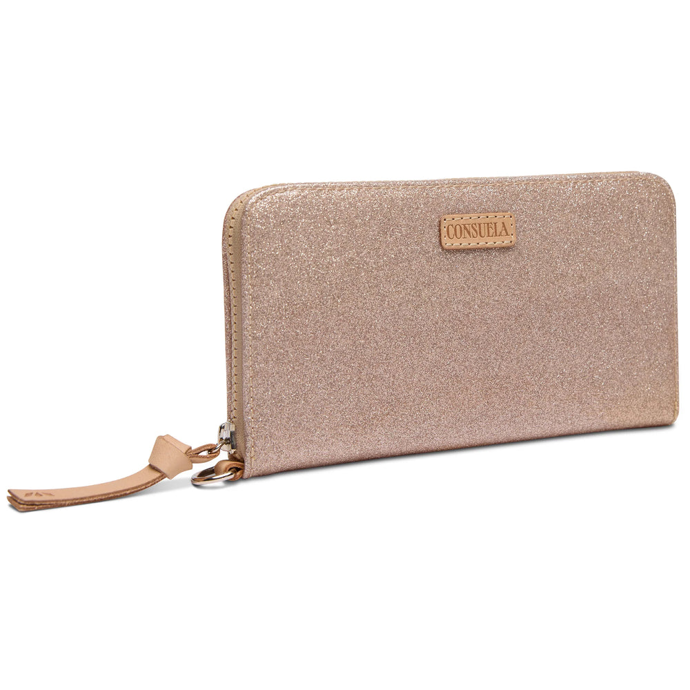 Close up of champagne glitter texture and gold-tone D-ring on the Emery Essential Wallet
