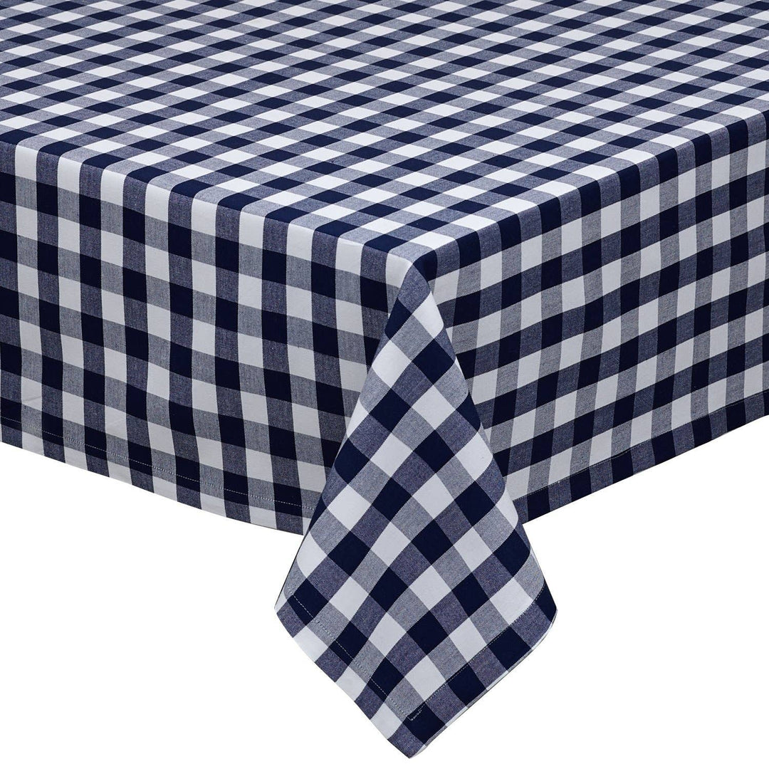 Rectangular blue and white check gingham tablecloth made of 100% cotton on a dining table.
