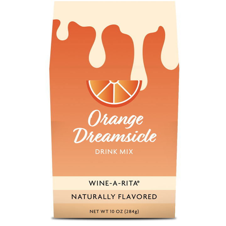 Orange Dreamsicle Boxed Mix packaging next to a frosted wine slushy glass with an orange slice garnish.