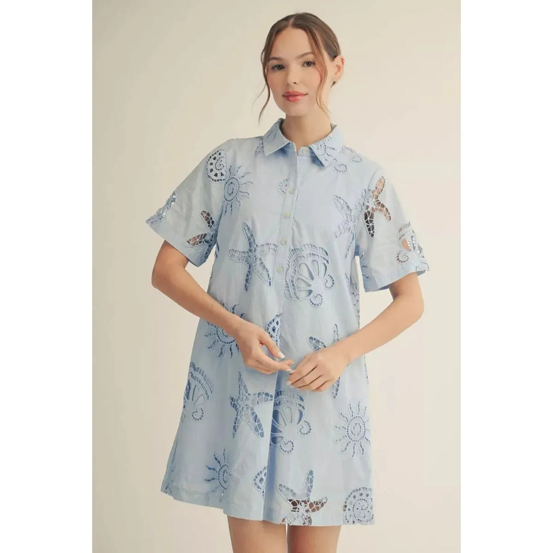 Jodifl Harlow short sleeve summer dress in blue cotton eyelet with front button details and pleating.