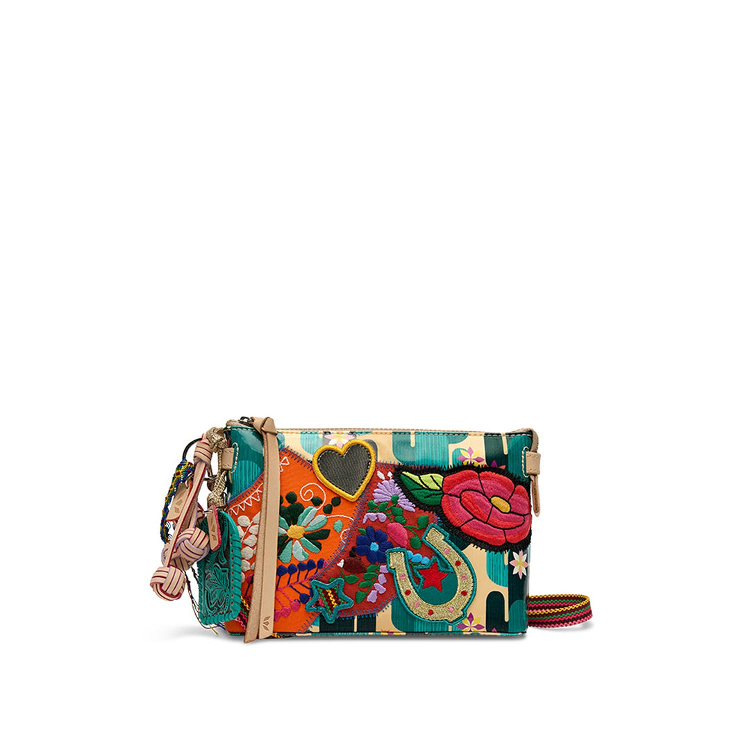 Consuela Dezi Midtown Crossbody in Spike print ConsuelaCloth with embroidered patches and natural leather trim