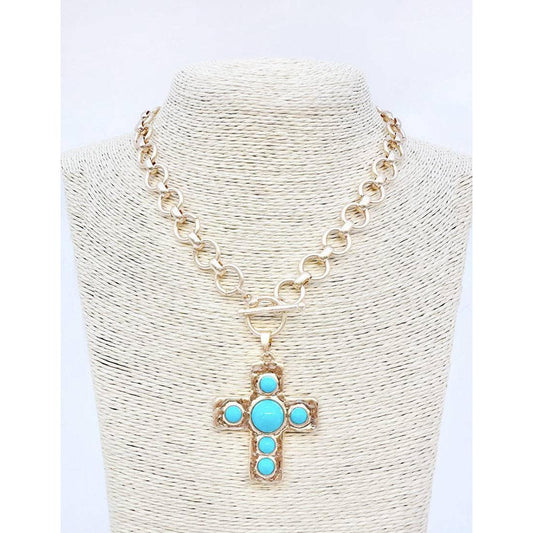 Necklace with a cross pendant featuring turquoise stones on a white background