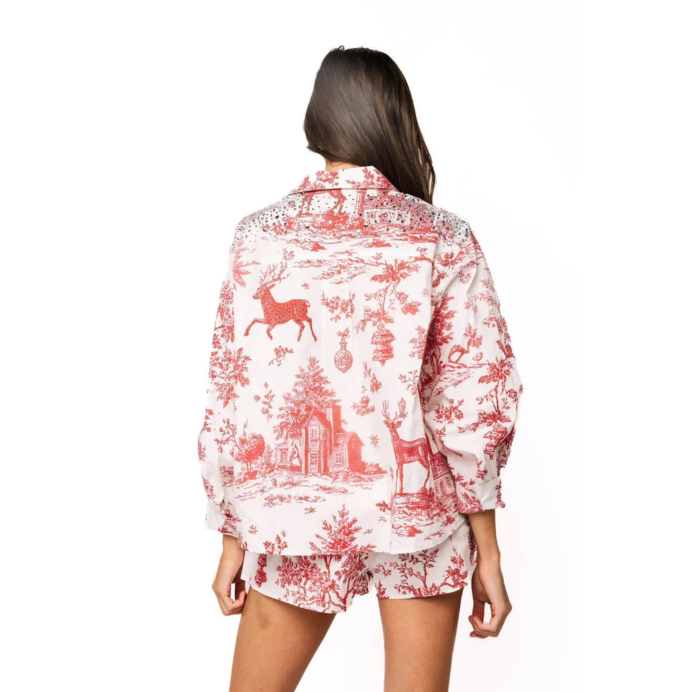 Model wearing the hand-embellished Queen of Sparkles Christmas toile women's boutique blouse.