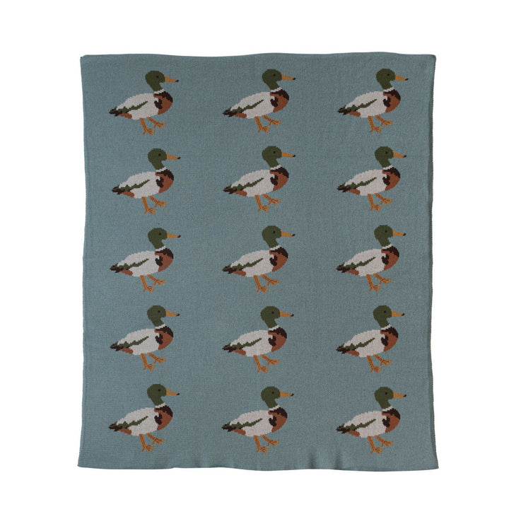Close-up of multicolor cotton knit baby blanket with mallard duck pattern.