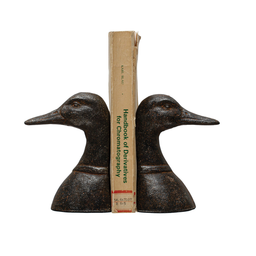 Creative Co-Op Set of 2 Cast Iron Duck Head Bookends in a distressed black finish.