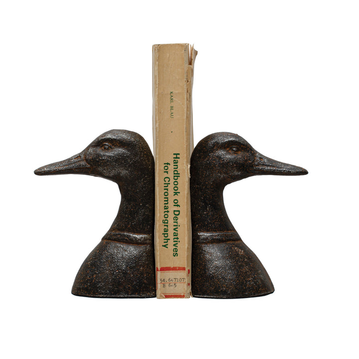 Creative Co-Op Set of 2 Cast Iron Duck Head Bookends in a distressed black finish.
