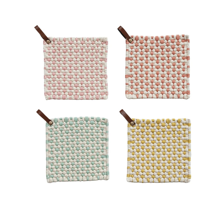 Text	Square hand-crocheted cotton pot holder in multicolor pattern with a brown leather hanging loop.