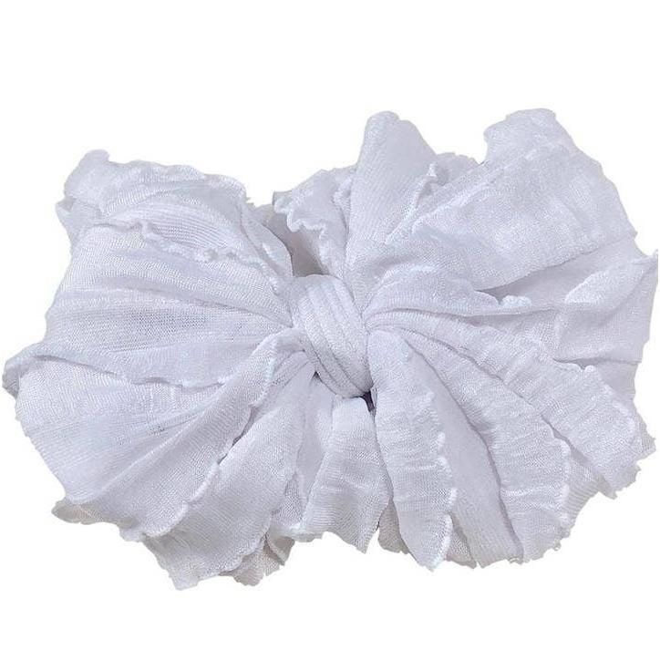 Rockin Royalty Ruffled Headband in White; a plush, stretchy, and textured white headband for infants and toddlers.
