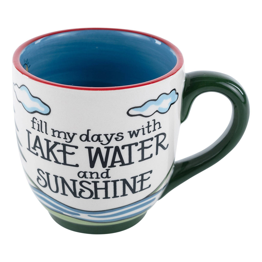 Glory Haus Lake Water and Sunshine ceramic mug showcasing a hand-painted canoe on a tranquil lake with blue water detailing.