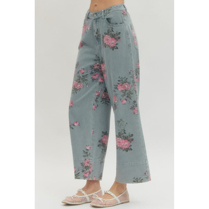 Floral-patterned jeans on a plain background
