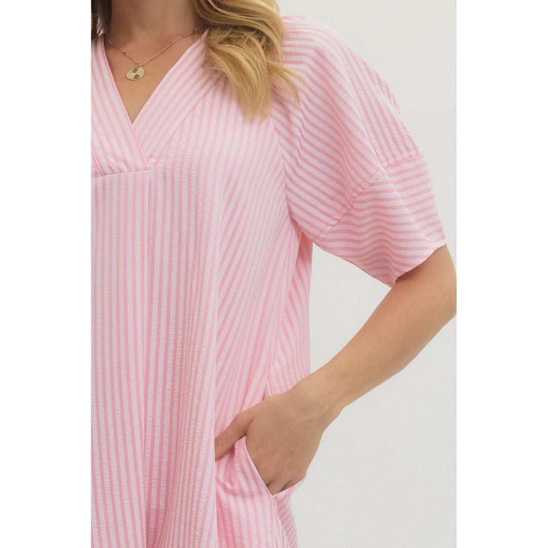 Close-up of the textured stripe fabric and side pocket detail on the Entro midi dress.