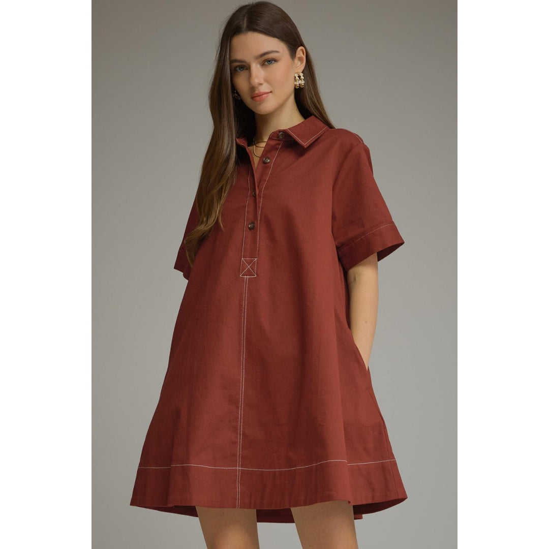 Model wearing the Entro Sienna Dress in Terra Cotta