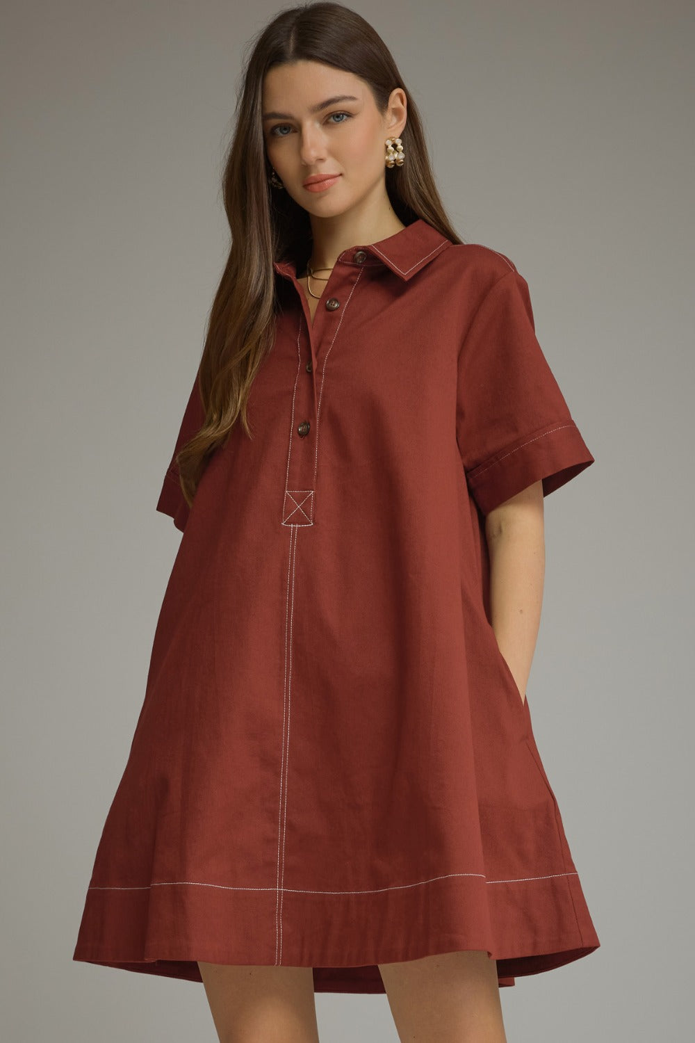 Model wearing the Entro Sienna Dress in Terra Cotta