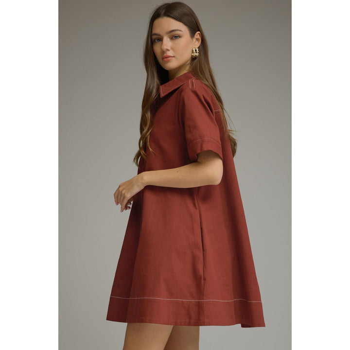 Model wearing the Entro Sienna Dress in Terra Cotta