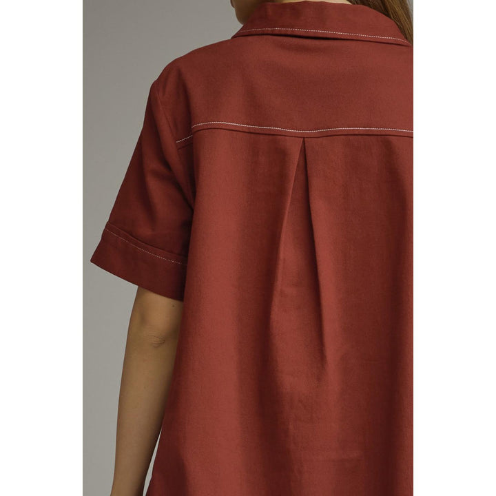 Model wearing the Entro Sienna Dress in Terra Cotta
