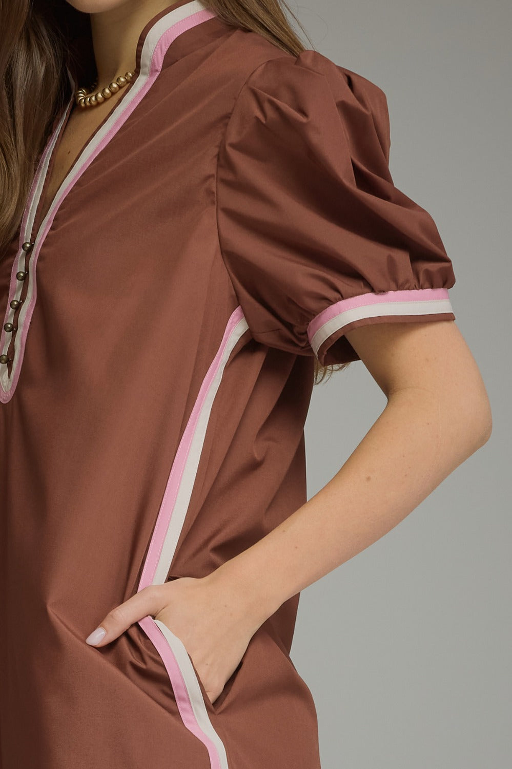 Model wearing the Entro Truffle Dress in Chocolate