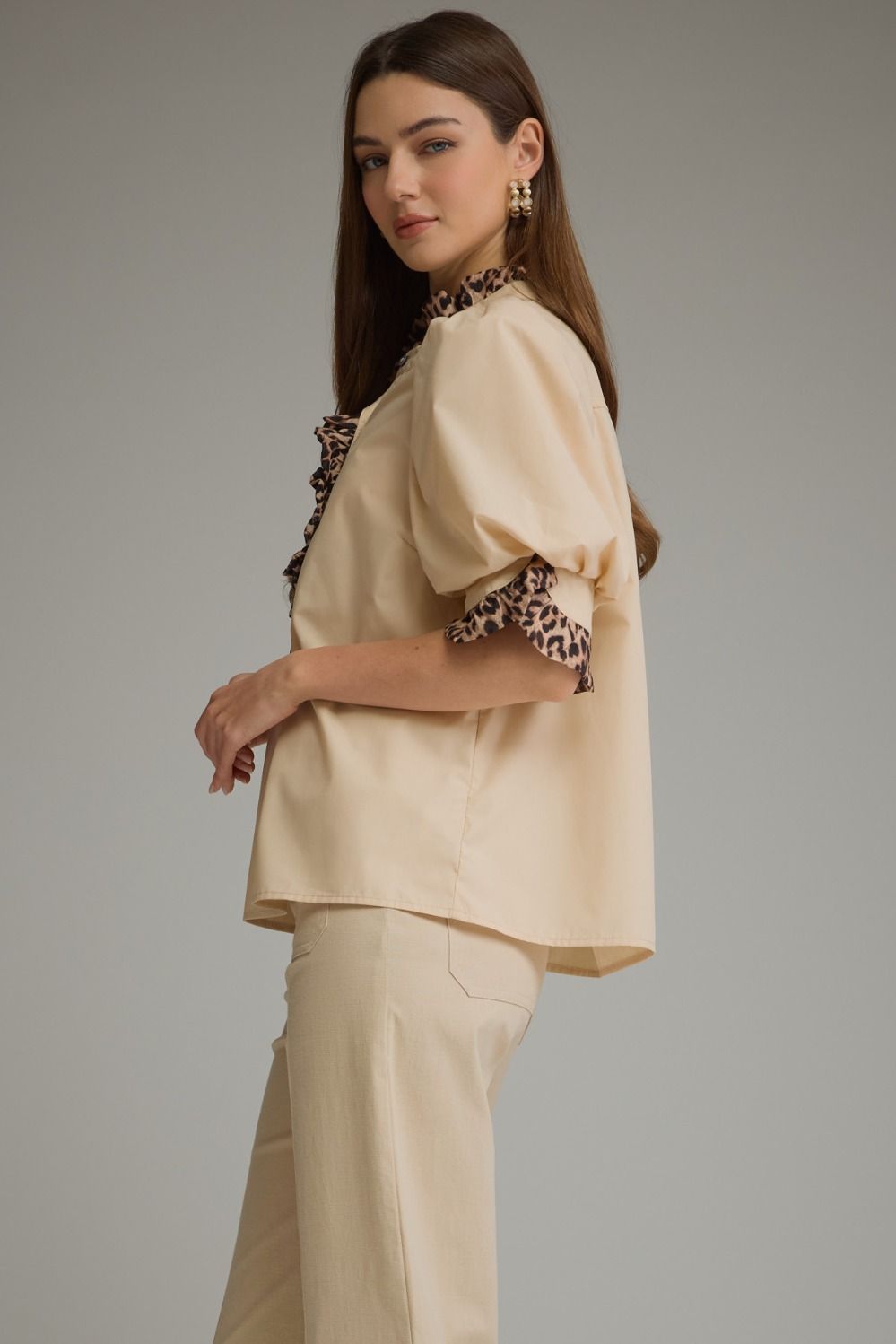 Entro Birch Top in Tan featuring a mock neckline, short sleeves, and an effortless silhouette.