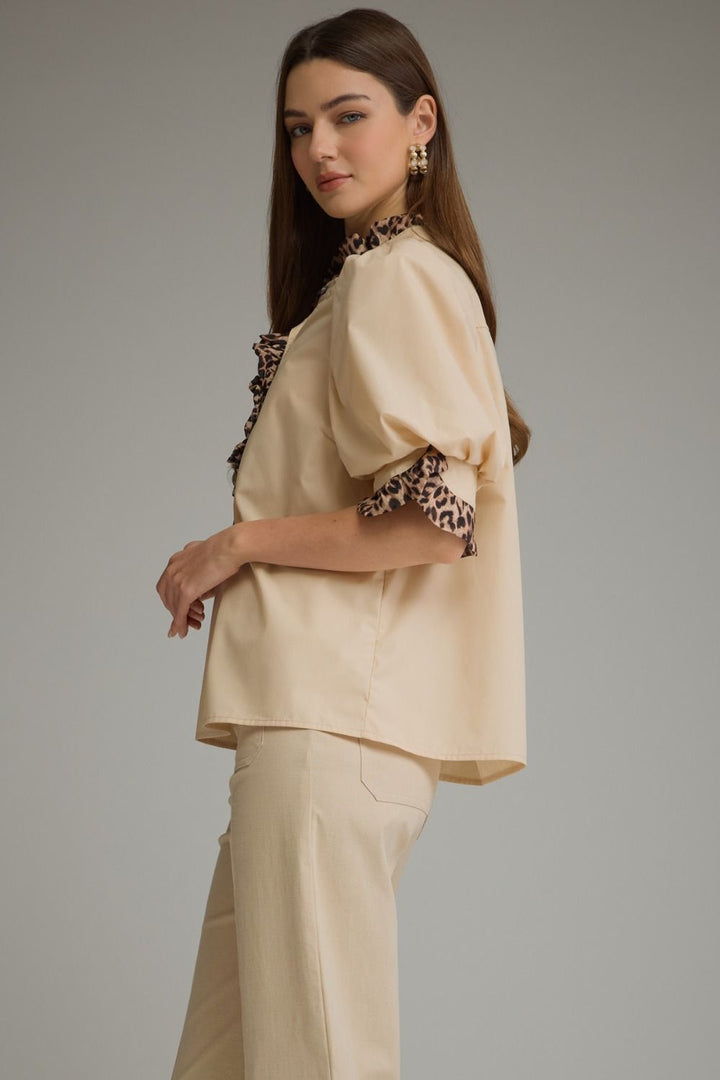 Entro Birch Top in Tan featuring a mock neckline, short sleeves, and an effortless silhouette.