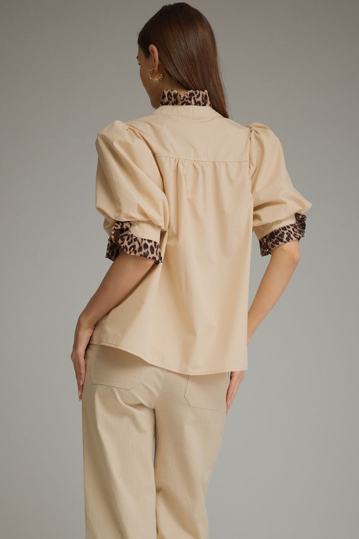 Entro Birch Top in Tan featuring a mock neckline, short sleeves, and an effortless silhouette.