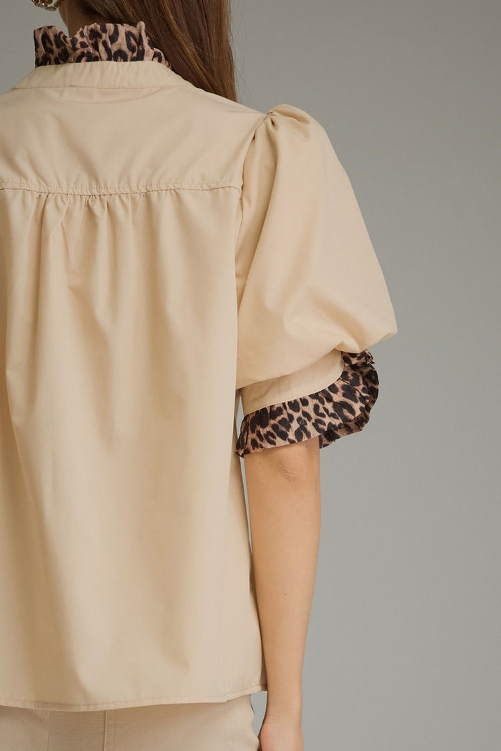 Entro Birch Top in Tan featuring a mock neckline, short sleeves, and an effortless silhouette.