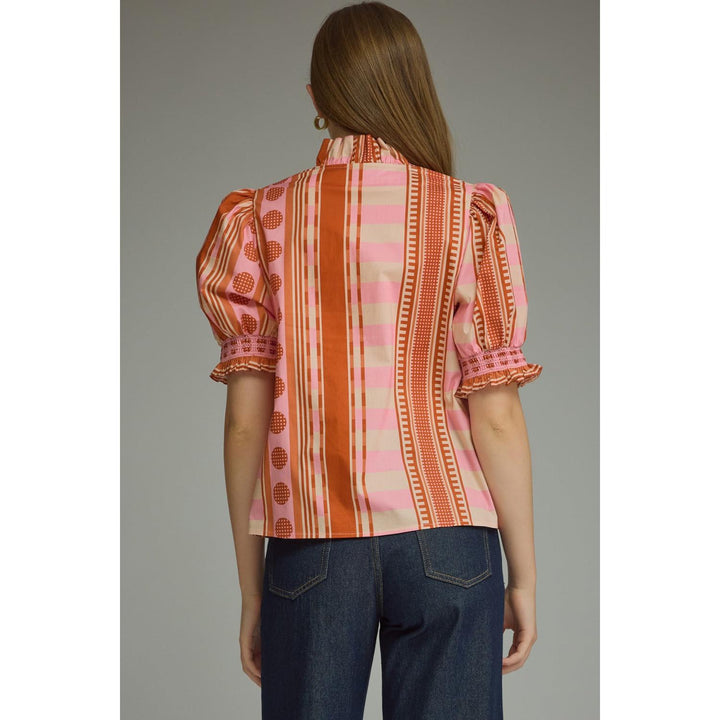Model wearing the Entro Rosette Top in Rust Pink