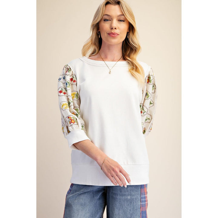 Wren ivory embroidered sleeve top, side view of relaxed fit