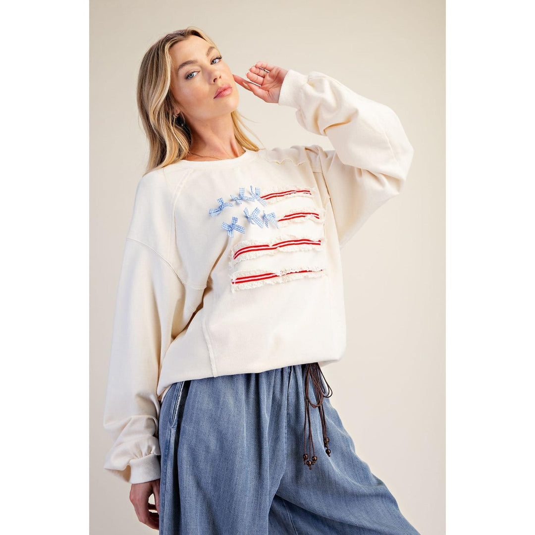 Libby flag sweatshirt styled with denim, relaxed boho fit