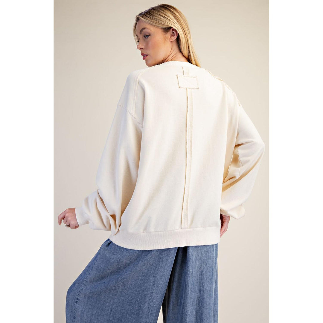 Back view of ivory mineral washed terry knit flag pullover