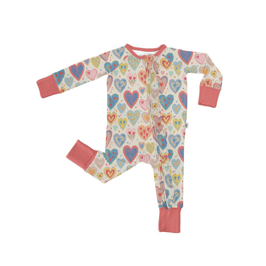 Children's onesie with heart pattern on a white background