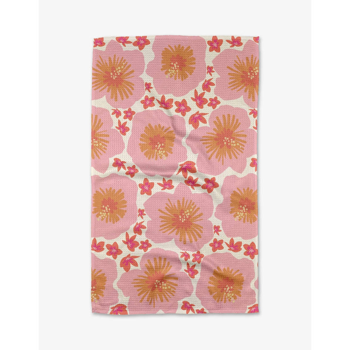 Flat lay of Geometry House Hibiscus Sunset Tea Towel by Janna Sue Design - Tropical Floral Print Eco-Friendly Geoweave Kitchen Towel 18x30